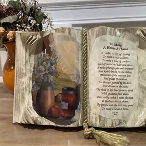 Decorative book featuring a poem by Jordan Bond titled” to make a house a home”